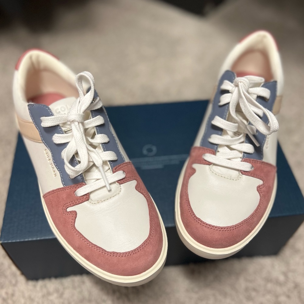 Cole Haan “Grand Crosscourt Modern Tennis Sneakers”.